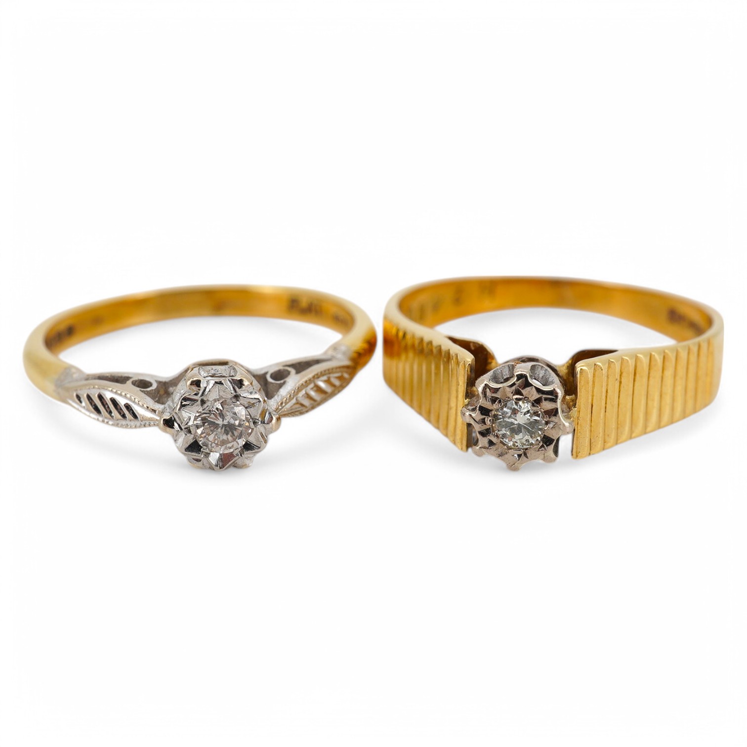 Two modern 18ct gold and illusion set single stone diamond set rings, sizes M and O, gross weight 6.1 grams.